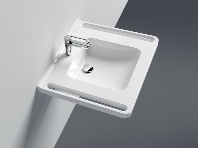 Washbasin with integrated side handles and single lever tap in chrome