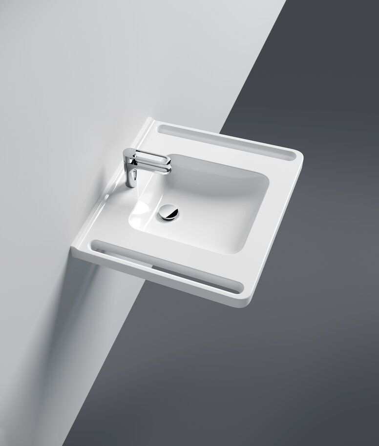 Washbasin with integrated side handles and single lever tap in chrome